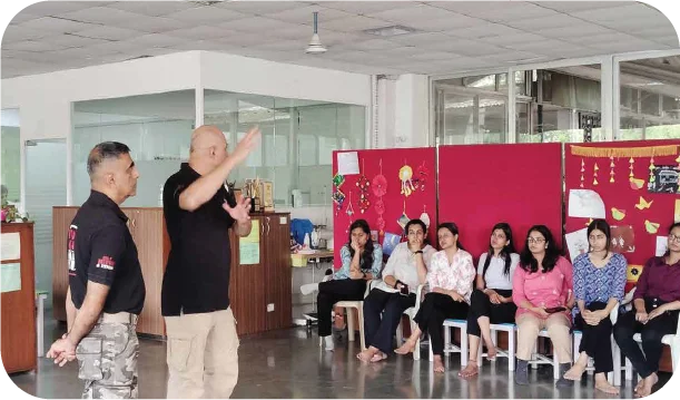 Instructor explaining safety concepts to seated participants during workshop